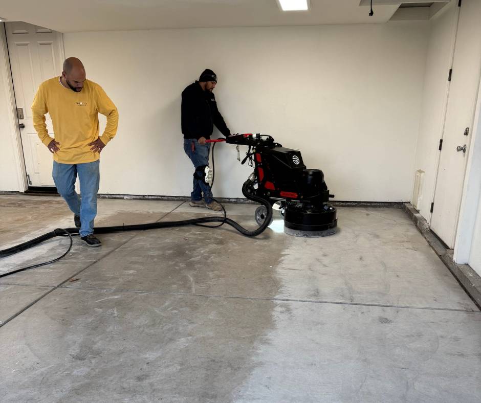 Professional garage floor diamond grinding to prepare concrete for an epoxy moisture barrier and polyaspartic coating in a Roseville, California home.