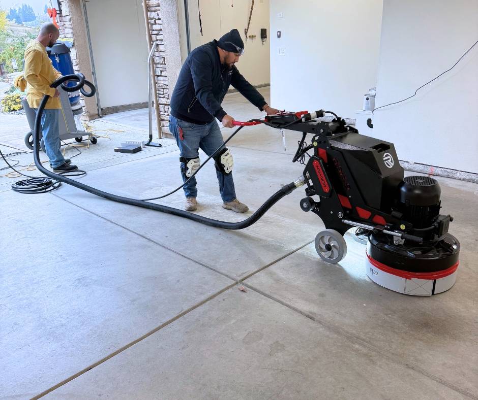TRICO PAINTING performing professional diamond grinding to prepare a concrete garage floor for an epoxy moisture barrier and polyaspartic coating system in Roseville, California.