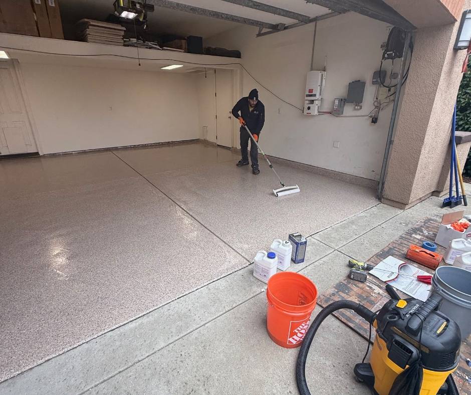 Garage floor coatings FAQ Roseville CA showing polyaspartic top coat applied over epoxy flake system