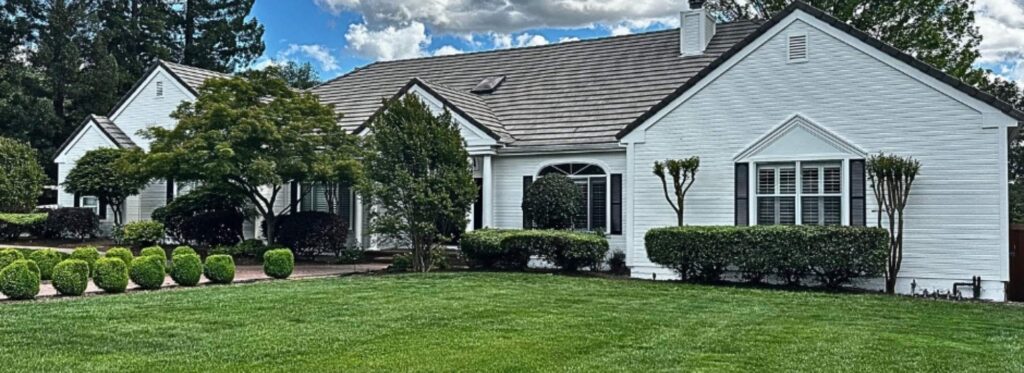 Warm white exterior home painted by Trico Painting featured in top exterior house colors for 2026